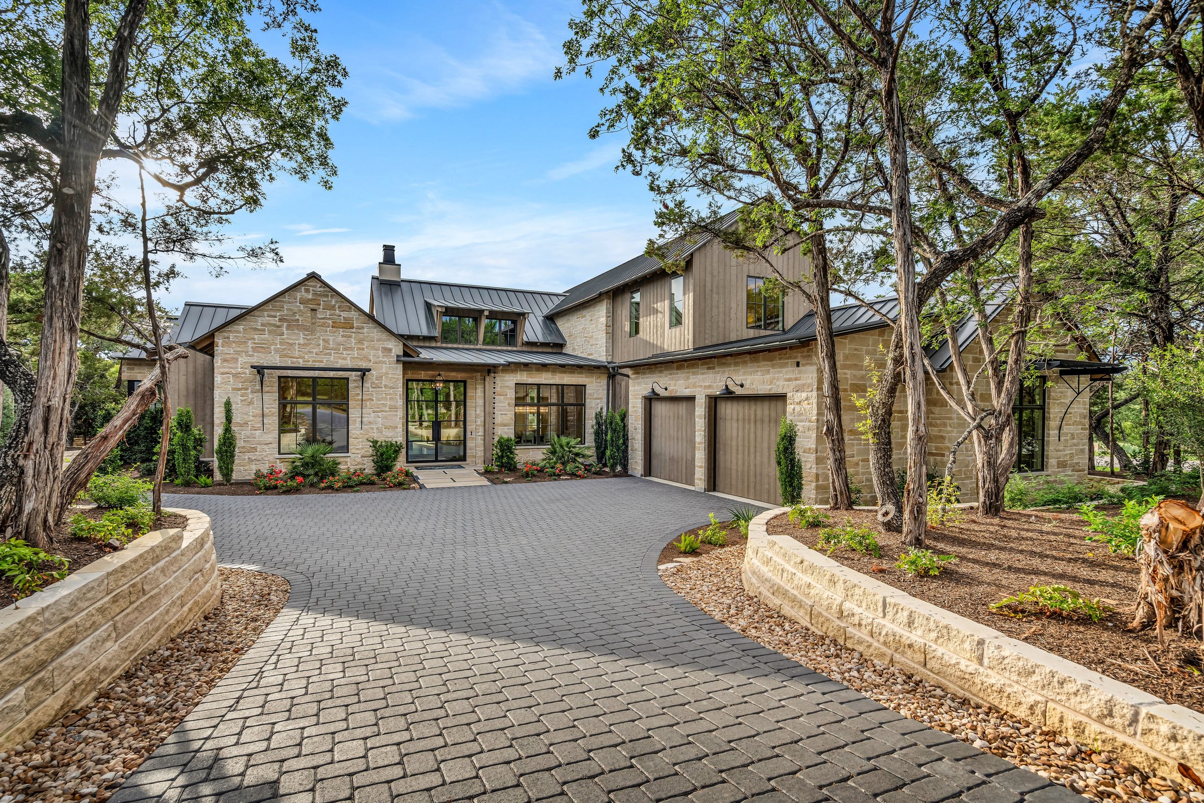 Tree-lined front approach to 4300 Amarra Drive
