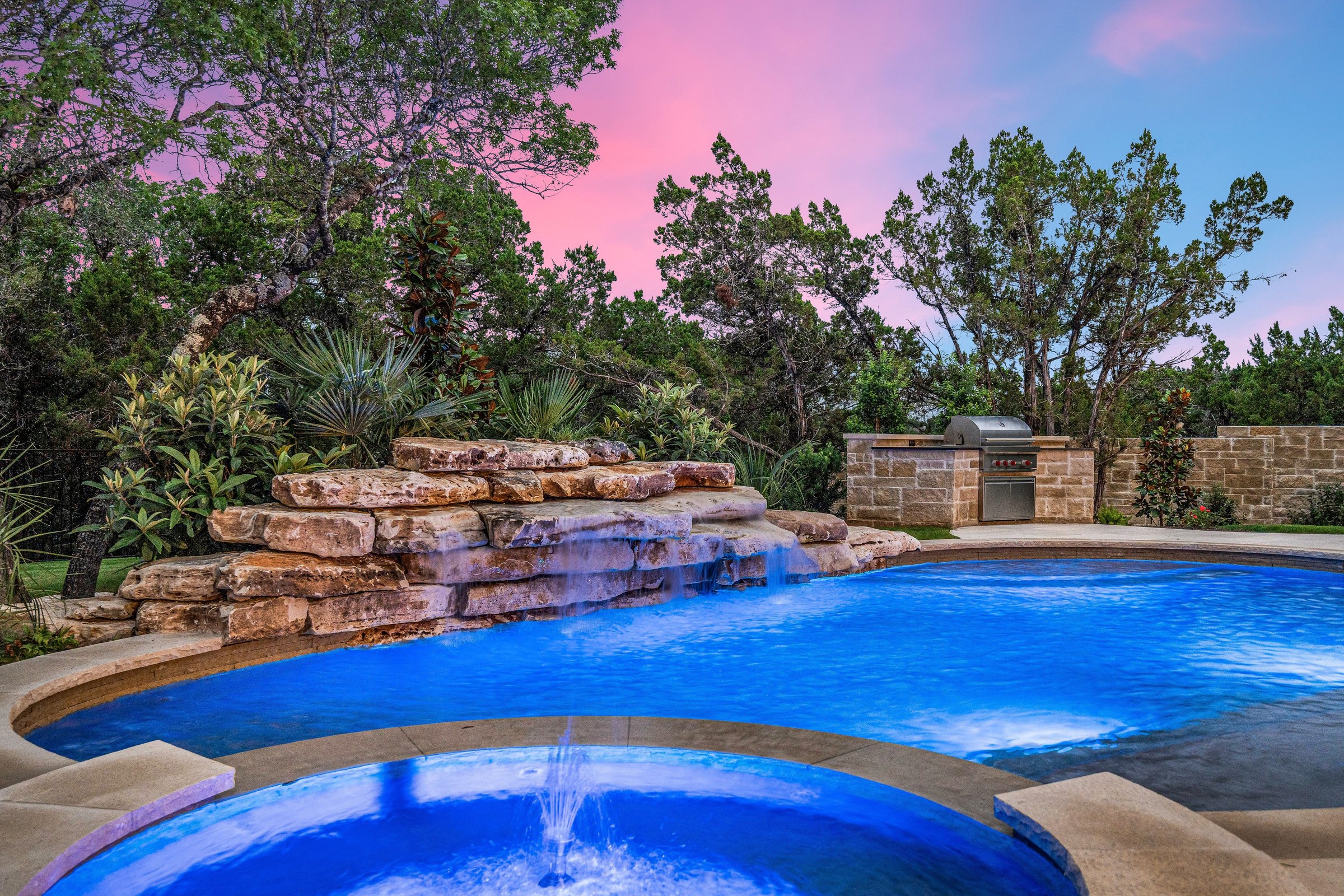 Pool and spa detail at 4300 Amarra Drive at twilight
